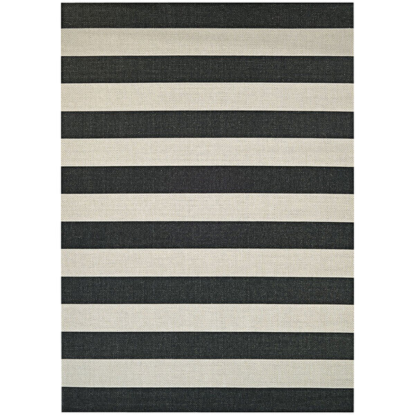 A black and white striped Couristan area rug with a white border.