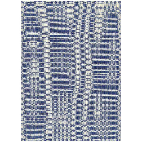 A navy blue Couristan area rug with a pattern of circles in white.