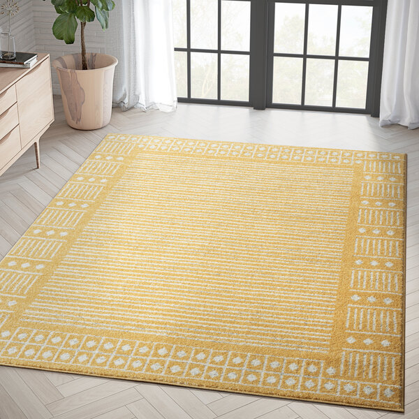 An Abani Casa Collection yellow Moroccan area rug with geometric designs in a room.