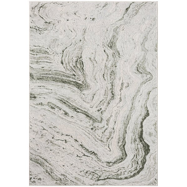 A close up of a green and white marble patterned Abani Atlas area rug.