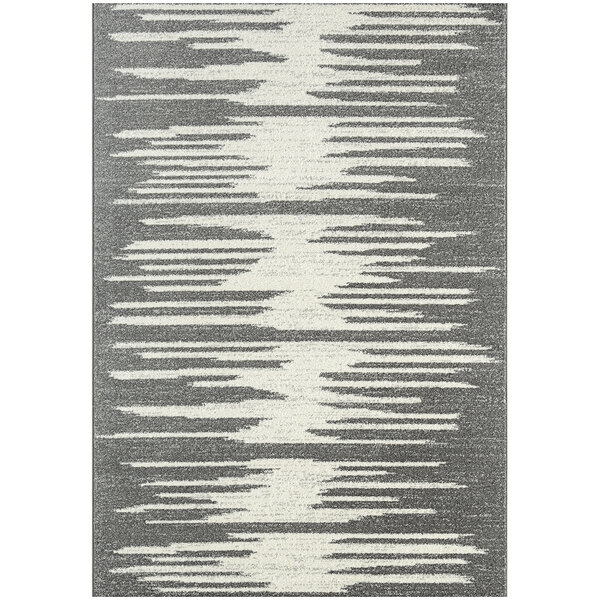 An Abani Casa Collection grey and white geometric area rug with jagged lines.