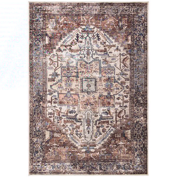 An Abani Lola Collection terracotta area rug with a vintage medallion pattern in a room with white walls.