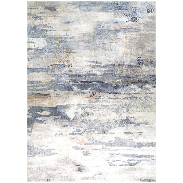 A close up of a blue and ivory Couristan Dreamscape Horizon area rug with an abstract design.