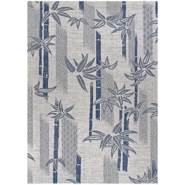 A Couristan area rug with ivory and blue bamboo stripes.