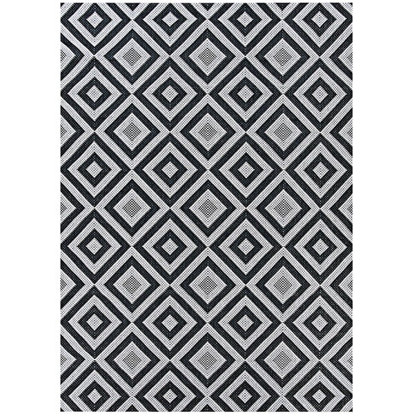 A black and white Couristan Afuera area rug with a diamond pattern.