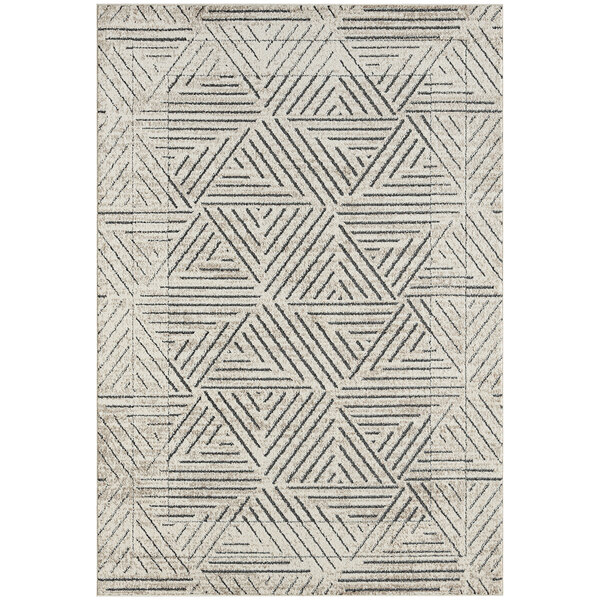 A close-up of a cream and grey Abani Cabo Collection area rug with geometric patterns.