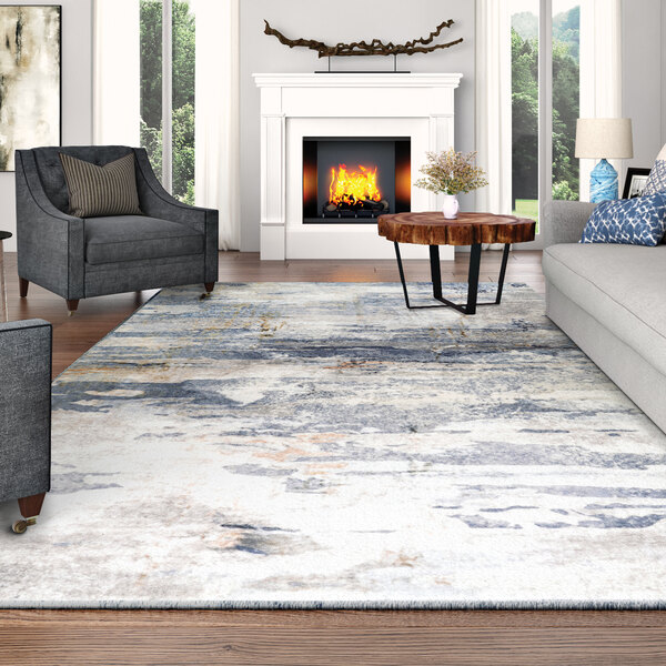 A Couristan Dreamscape Horizon blue and ivory runner rug in a living room with a fireplace and couch.
