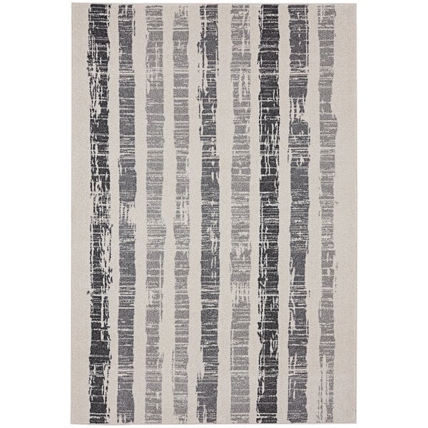 An Abani Casa Collection Moroccan area rug with faded black and white stripes.