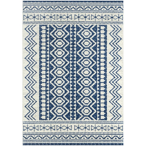 A navy and cream area rug with a geometric pattern in blue and white.