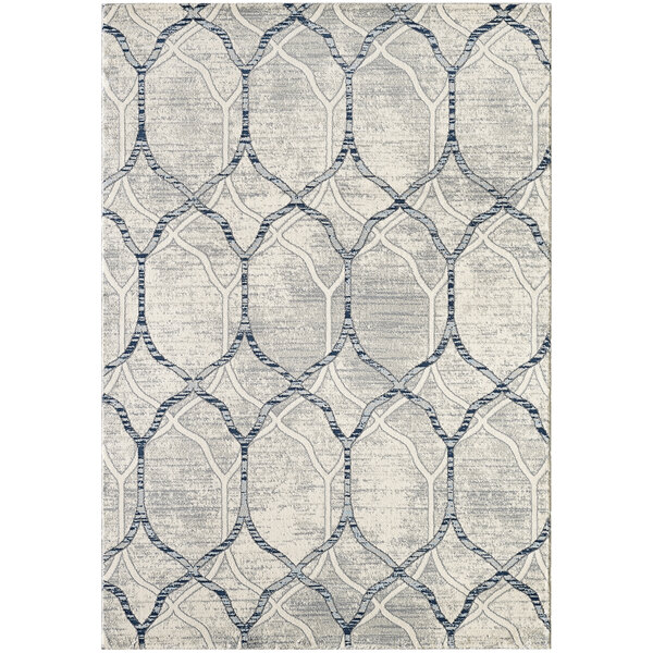 A close up of a cream and grey Abani Arto Collection area rug with a geometric pattern.