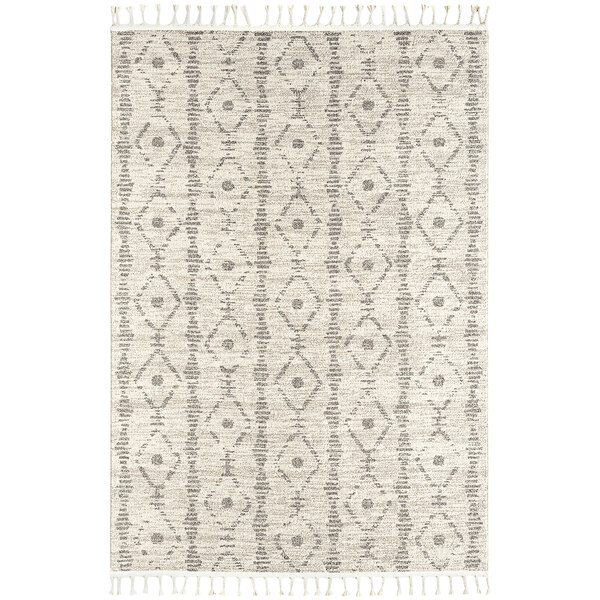 An Abani Layla Collection beige and brown rug with a diamond pattern and fringes.