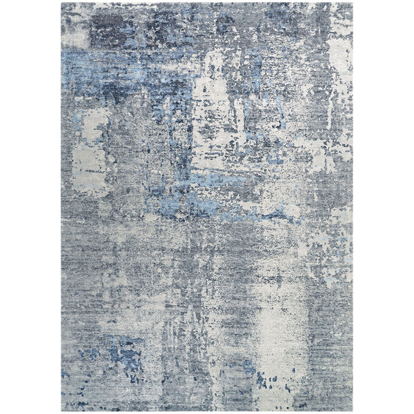 A close up of a Couristan Dreamscape Odyssey runner rug with blue and grey tones.