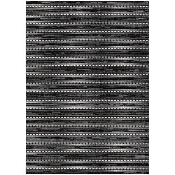 A black and white striped Couristan area rug with a white border.