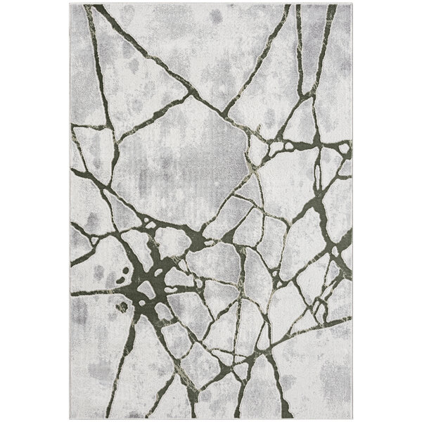 A green and gray Abani Atlas Collection area rug with a cracked pattern.
