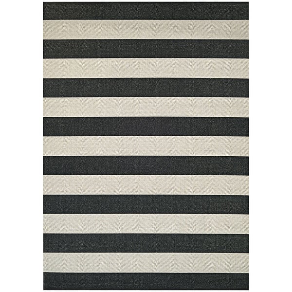 A black and white striped Couristan area rug with a white border.