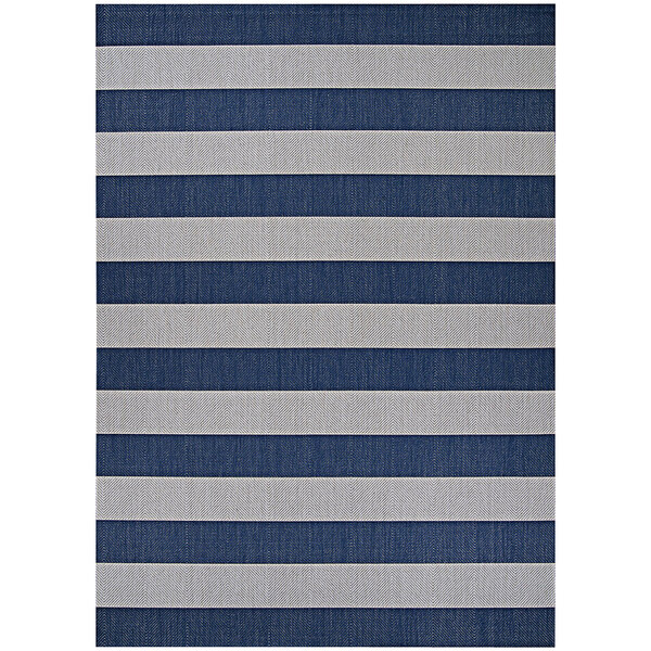 A close up of a Couristan Afuera Yacht Club blue and white striped rug.