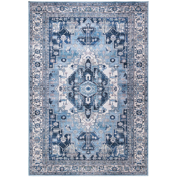 An Abani Molana Collection beige and blue area rug with a traditional medallion design.