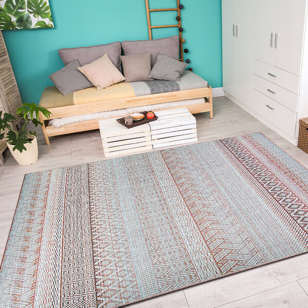 A white room with a Couristan Cape Gables hibiscus runner rug.