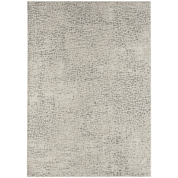 An Abani Layla Collection area rug with a distressed brown and beige animal print pattern.