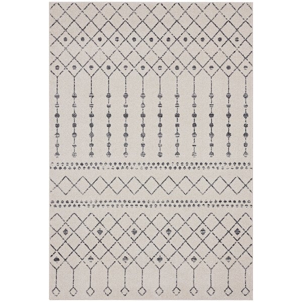 A close up of an Abani Casa Collection cream and gray Moroccan trellis area rug with a geometric pattern.