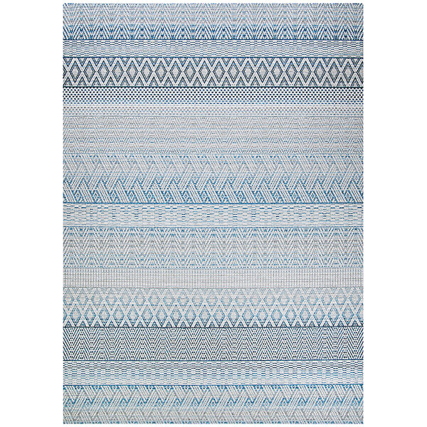 A Couristan Cape Gables surf area rug with blue and white geometric patterns.