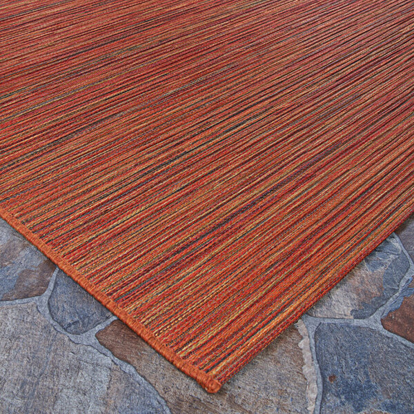 A close up of the Couristan Cape Hinsdale area rug with orange stripes.