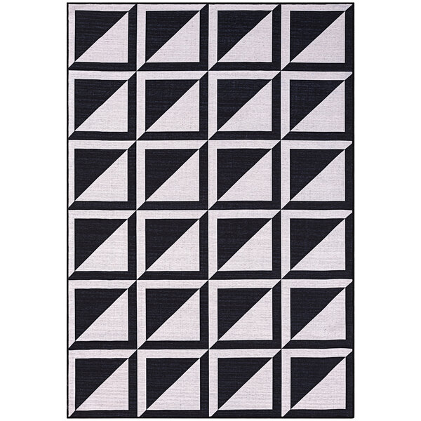 A cream and black area rug with a geometric square pattern.