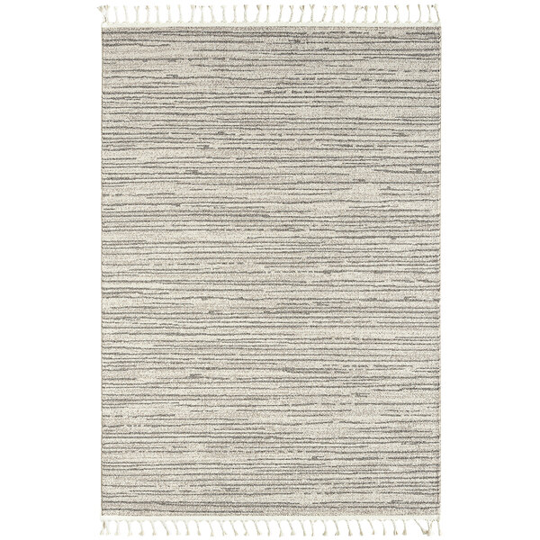 An Abani Layla Collection beige and brown area rug with fringes.