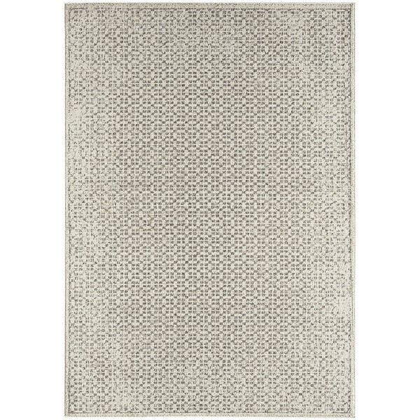 An Abani Layla Collection beige rug with a geometric pattern.