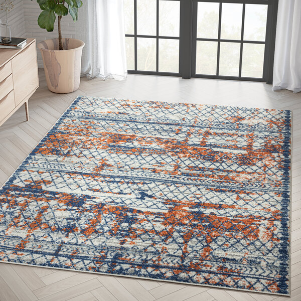 An Abani Casa Collection multicolor area rug with a contemporary distressed pattern in a room.