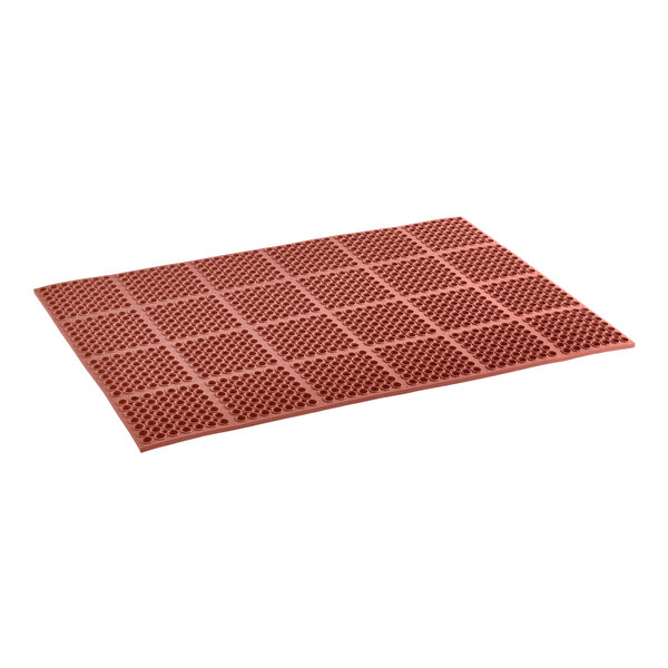 A close-up of a red rubber Lavex anti-fatigue floor mat with squares on it.