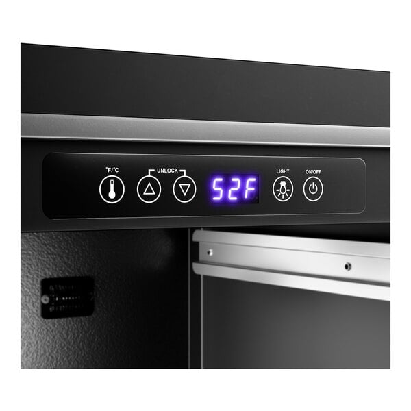 A beverage cooler with a digital temperature display and control panel.