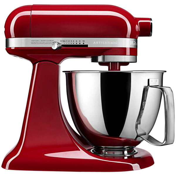 A red KitchenAid Mini Plus countertop mixer with a silver bowl.