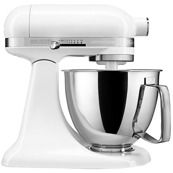 A close-up of a white KitchenAid Mini Plus countertop mixer with a silver bowl.