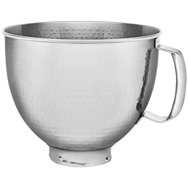 A silver KitchenAid stainless steel mixing bowl with a handle.