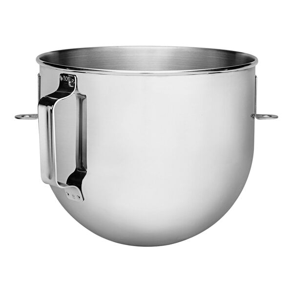 A close-up of a silver KitchenAid stainless steel mixing bowl with a handle.