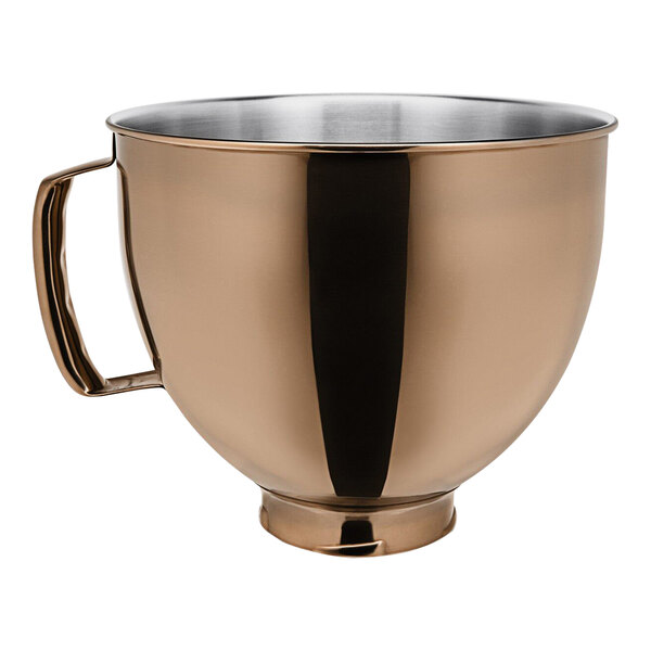A KitchenAid stainless steel mixing bowl with a handle.