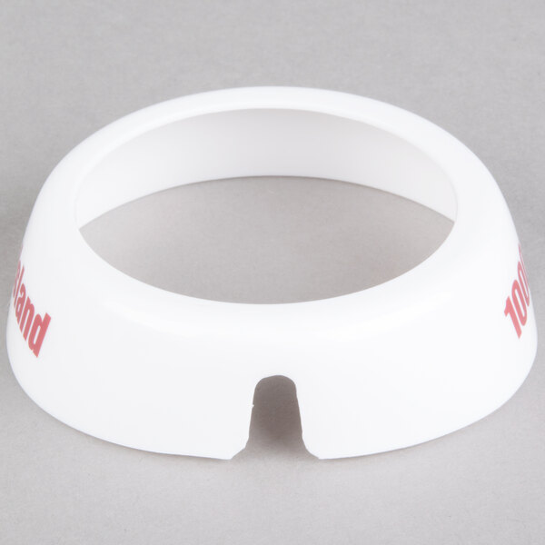 A white circular plastic Tablecraft dispenser collar with red lettering.