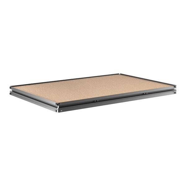 A rectangular black particleboard shelf.