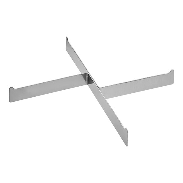 A stainless steel tray with two metal crosses.