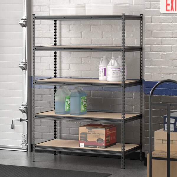 A Lavex black steel upright for boltless shelving units on a shelf with bottles and boxes.