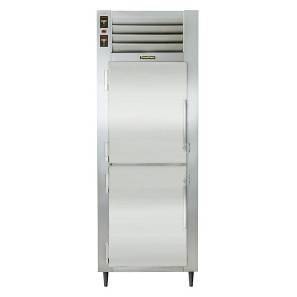 A Traulsen stainless steel refrigerator with white doors and a white handle.