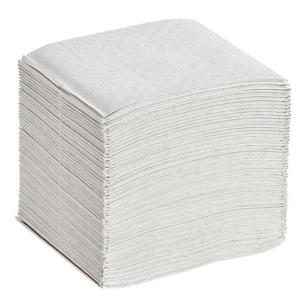 A stack of Tork Xpressnap white interfold dispenser napkins.