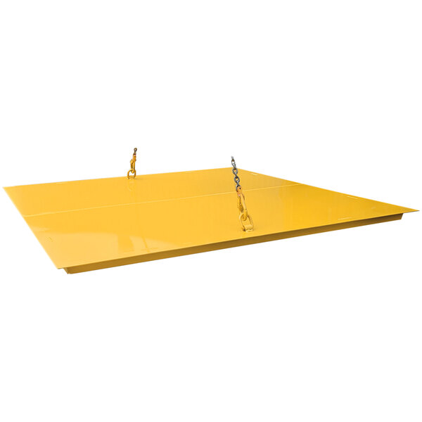 A yellow steel lid with chains on it.