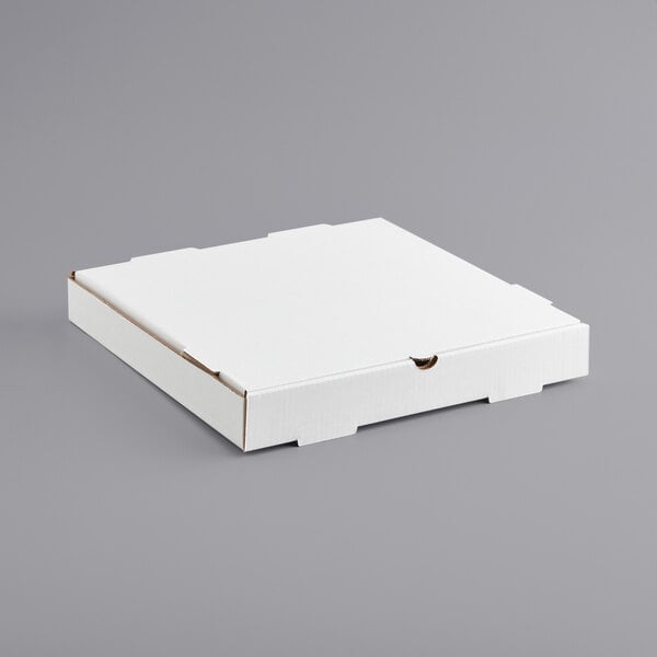 A white Choice plain pizza box on a gray surface.