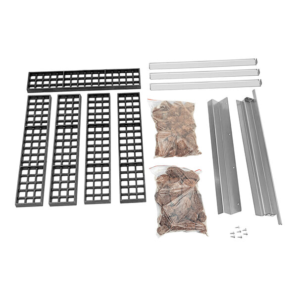 A metal rack with black rectangular lava rocks on it.