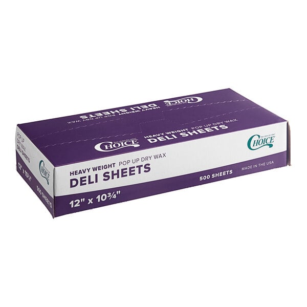A purple and white box of Choice heavy weight interfolded deli wrap wax paper sheets on a counter.