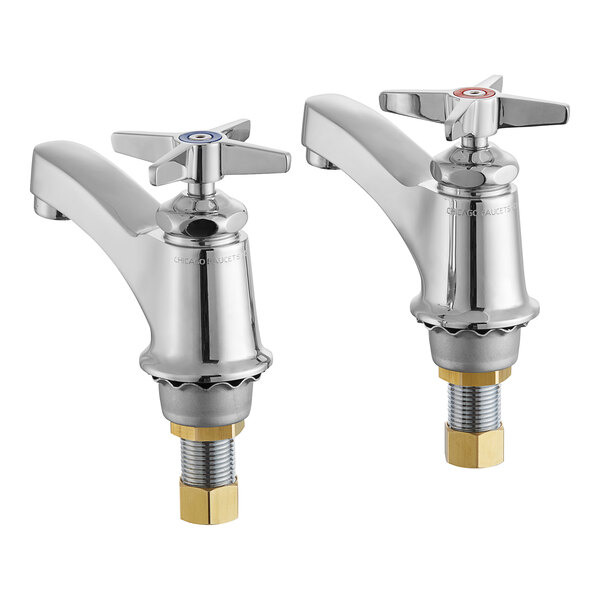 Two chrome Chicago Faucets deck-mounted faucets with brass cross handles.