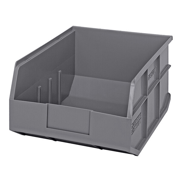 A gray plastic Quantum stackable shelf bin with two compartments.