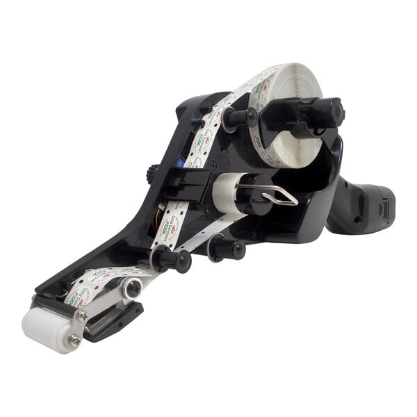 A Tach-It black label dispenser with white labels.